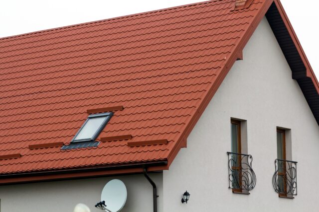 Roof of a new house made from yellow roofing tiles
